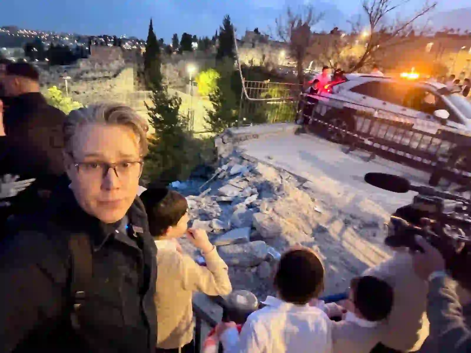 Joshua Swanson reporting near the scene of a missile strike in the Old City of Jerusalem, March 2026