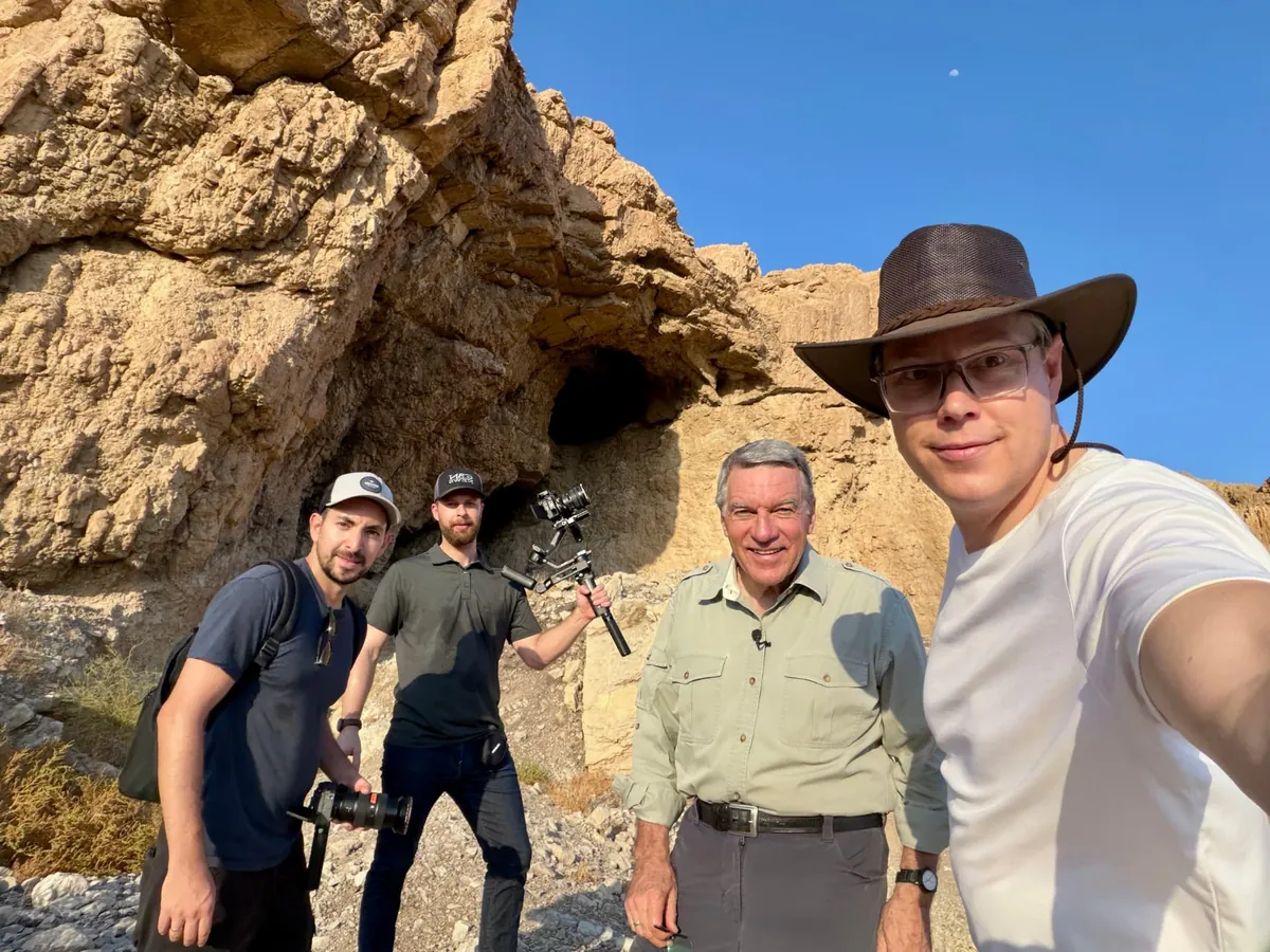 Joshua Swanson with Chris Mitchell and the Jerusalem Dateline crew hiking Qumran