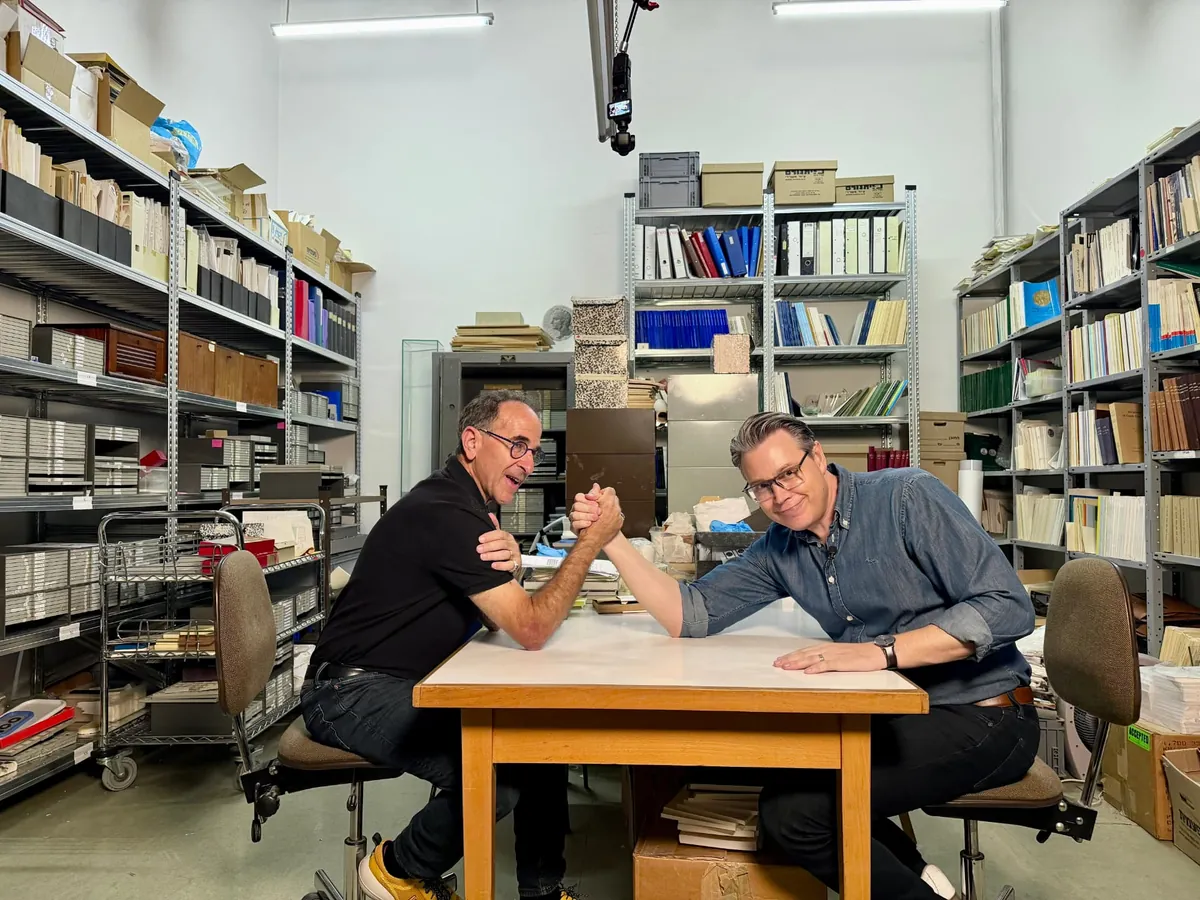 Joshua Swanson arm wrestling Dr. Haim Gitler of the Israel Museum